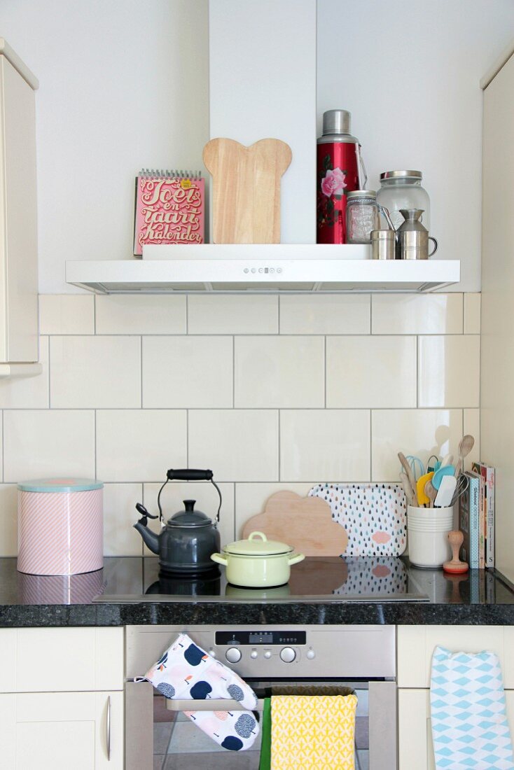 Retro kitchen utensils on kitchen counter with granite worksurface