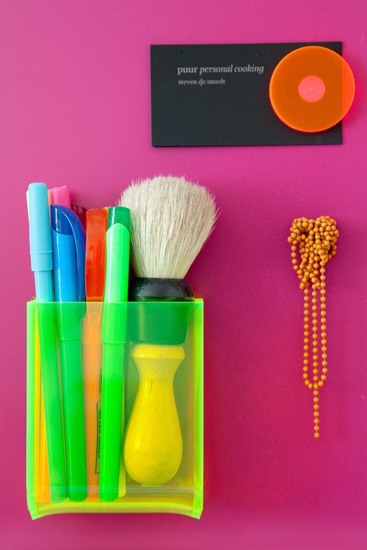 Detail of desk tidy in neon shades