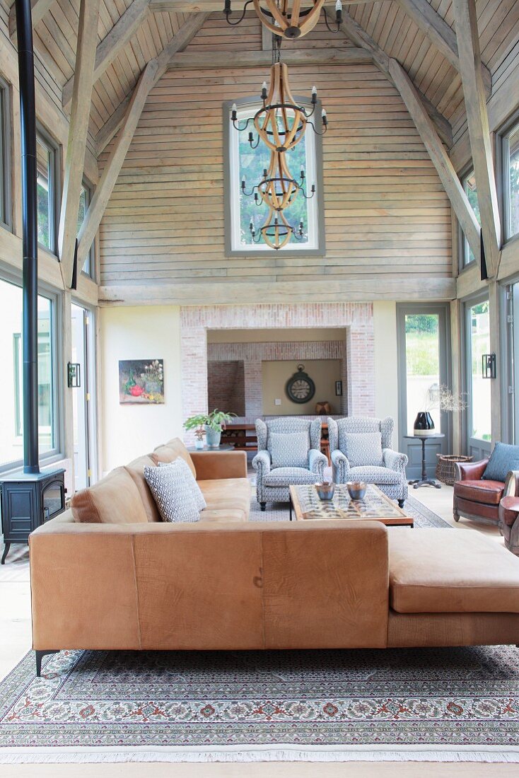 Sofa set in high-ceilinged wood-clad interior