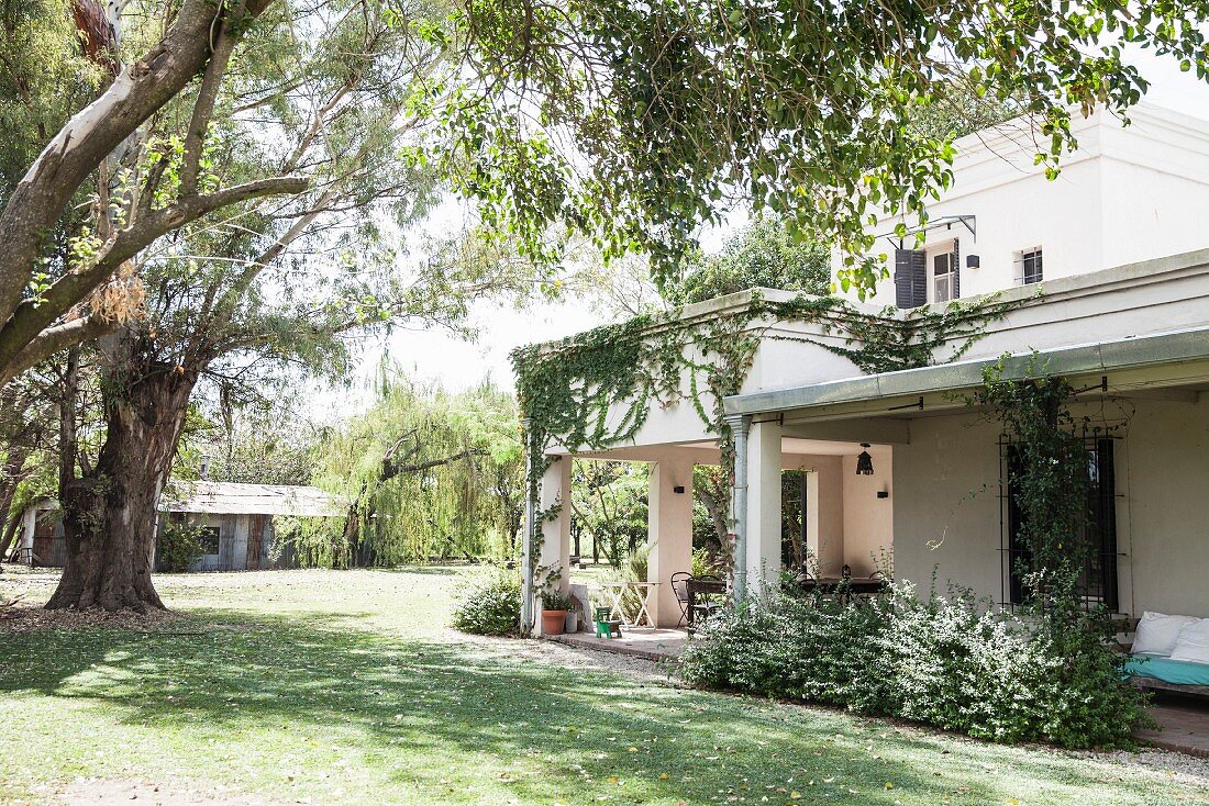 View from garden to house with roofed terrace