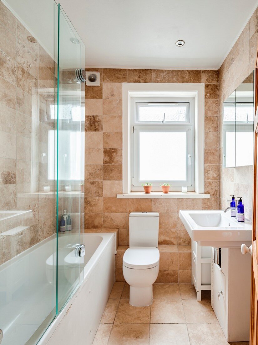 Stone tiles in bright bathroom