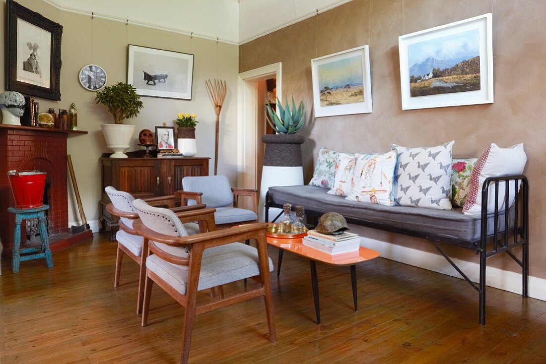 bench and upholstered chairs in eclectic living room
