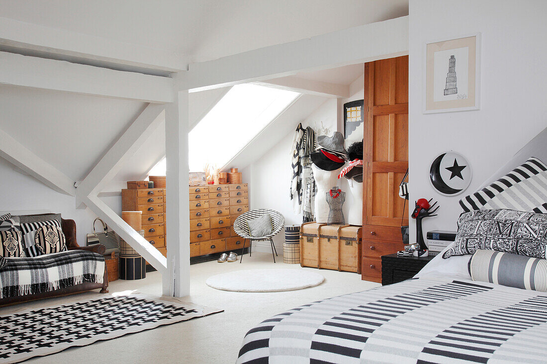 Black-and-white patterned textiles in attic bedroom