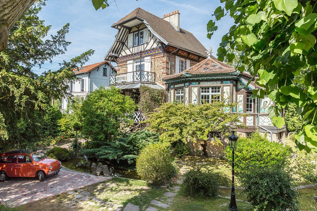 Traditional half-timbered house with Oriental elements in summery surroundings