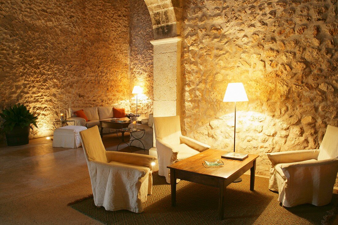 Mediterranean living room with stone walls