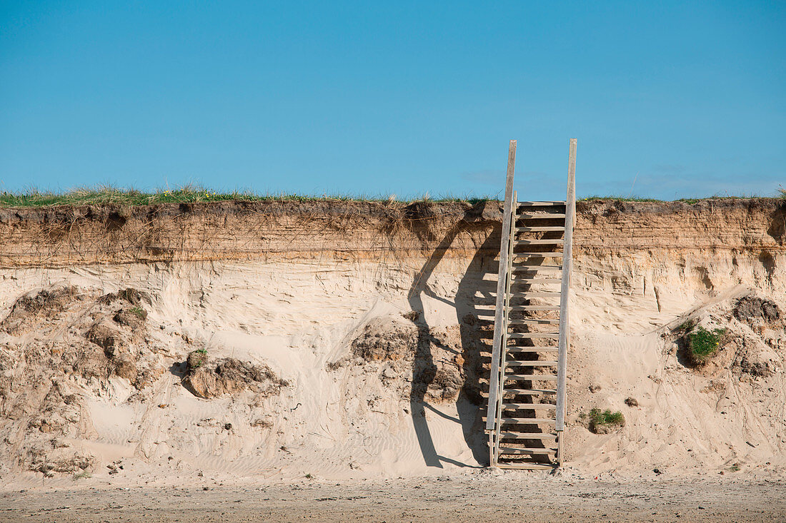 Wooden steps leading up sand dune
