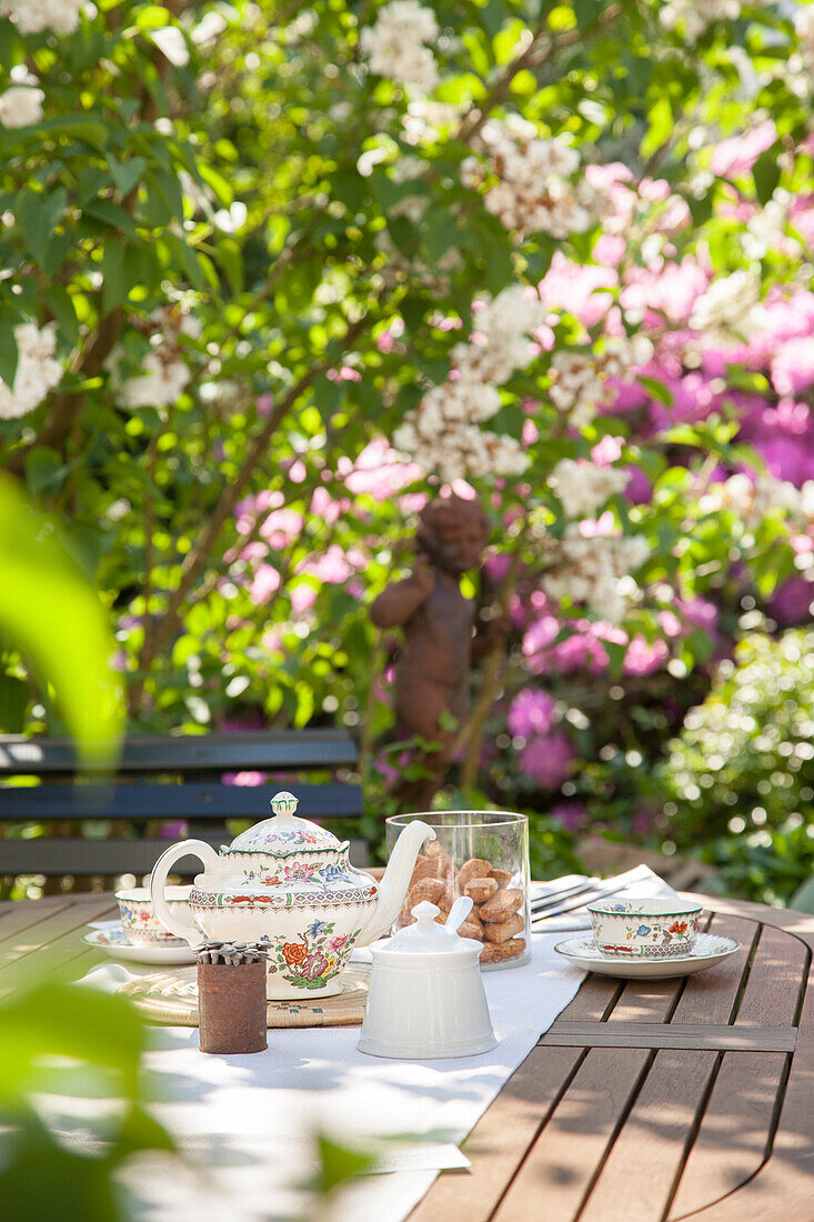 Table set for afternoon tea in summer garden