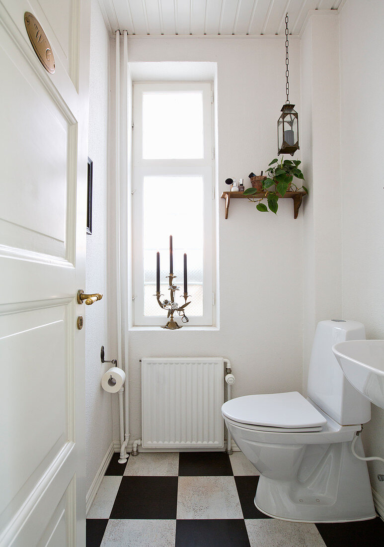 Simple toilet with chequered floor