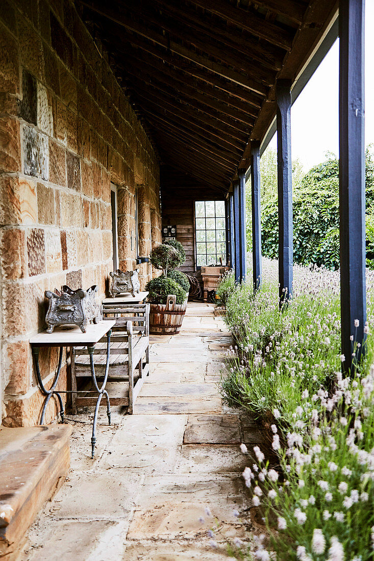 Veranda of a stone house with lavender beds