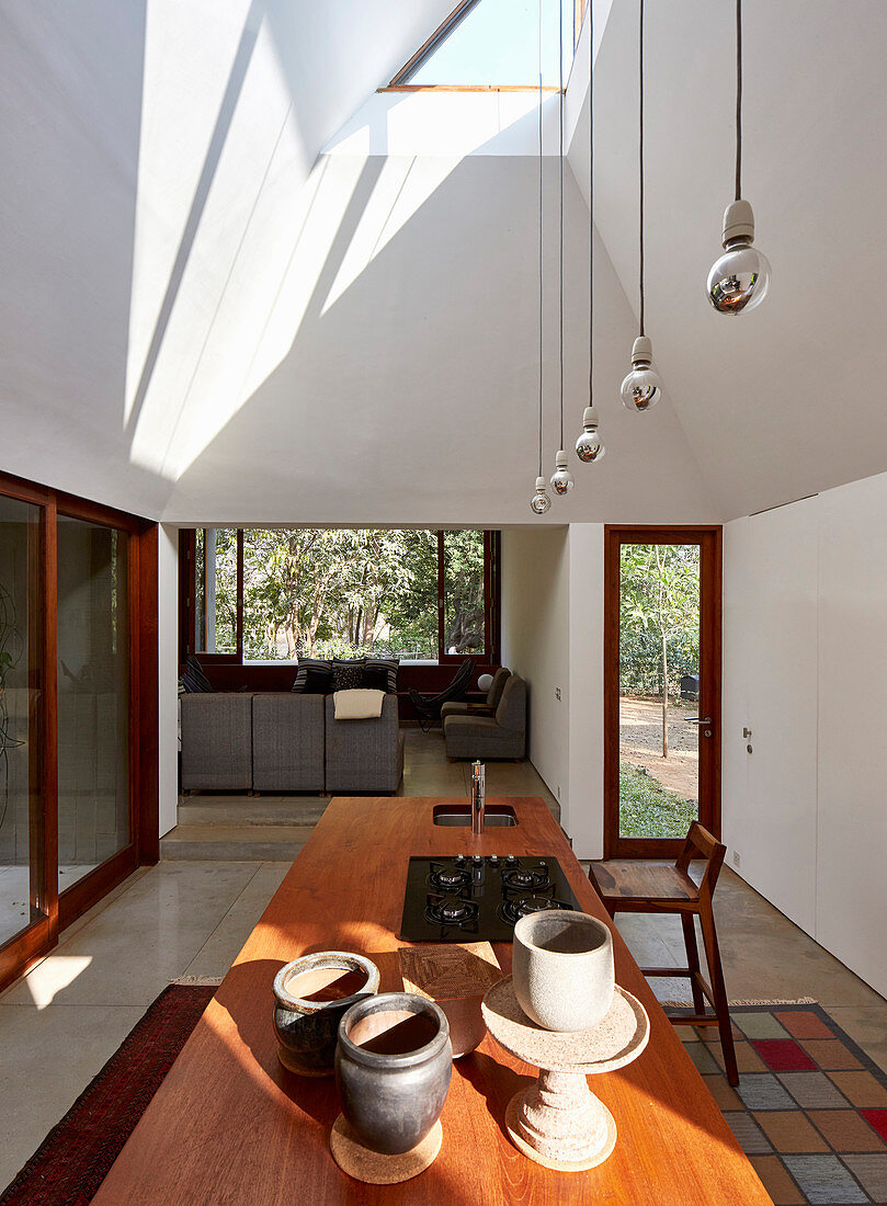 View across kitchen island into living room of architect-designed house
