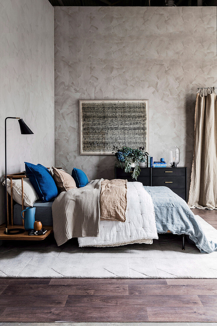 Bedroom with blue and earth colored accessories