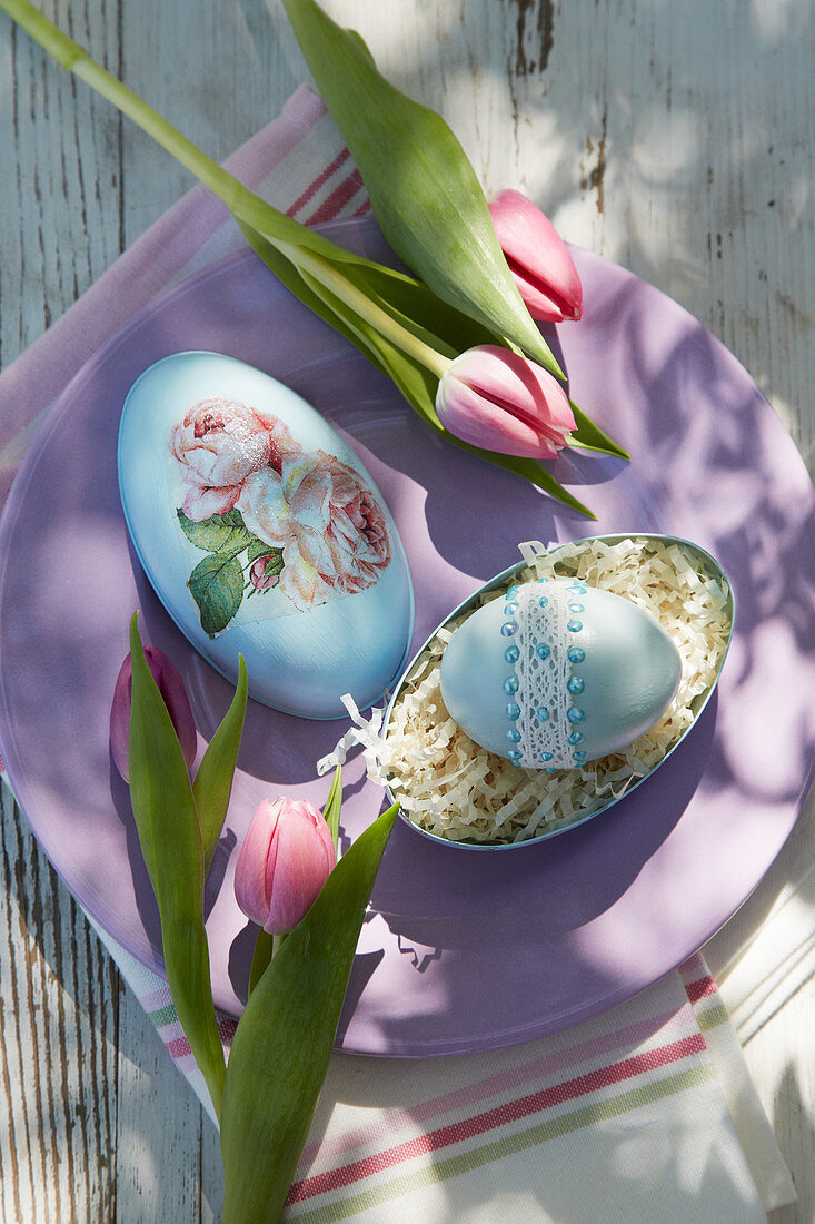 Easter egg decorated with lace ribbon and beads in egg-shaped box