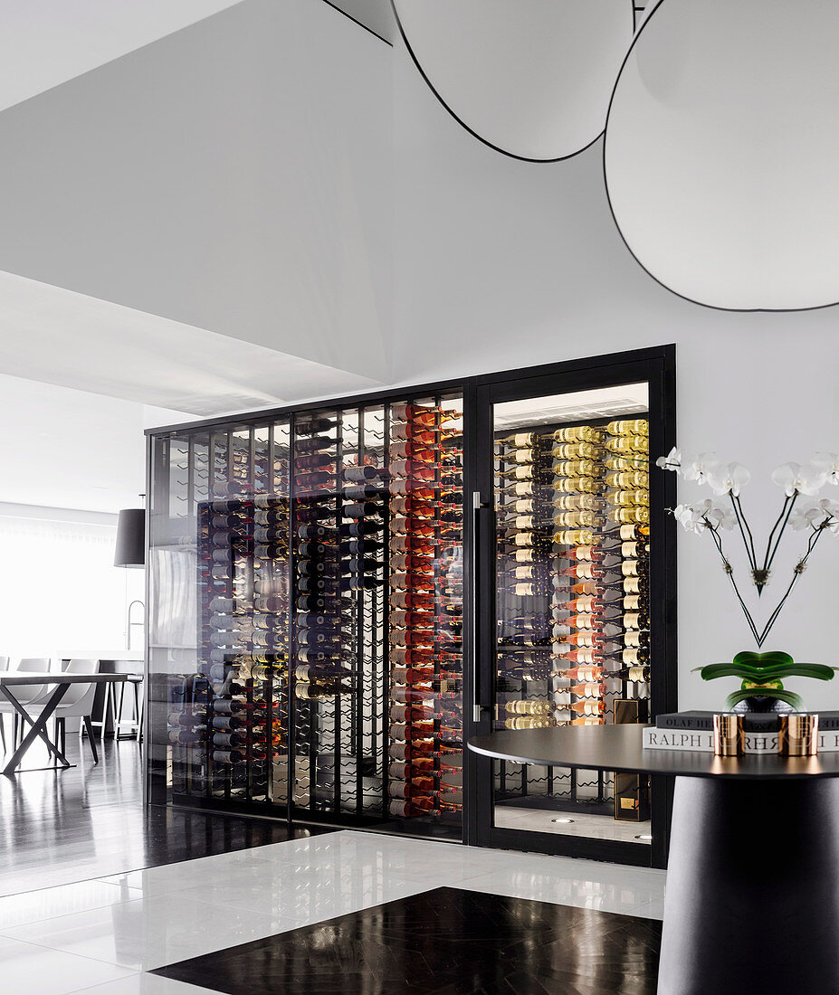 View of designer wine cabinet in open living room