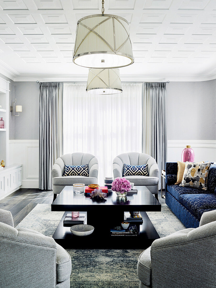 Bright living room with upholstered furniture and a dark coffee table