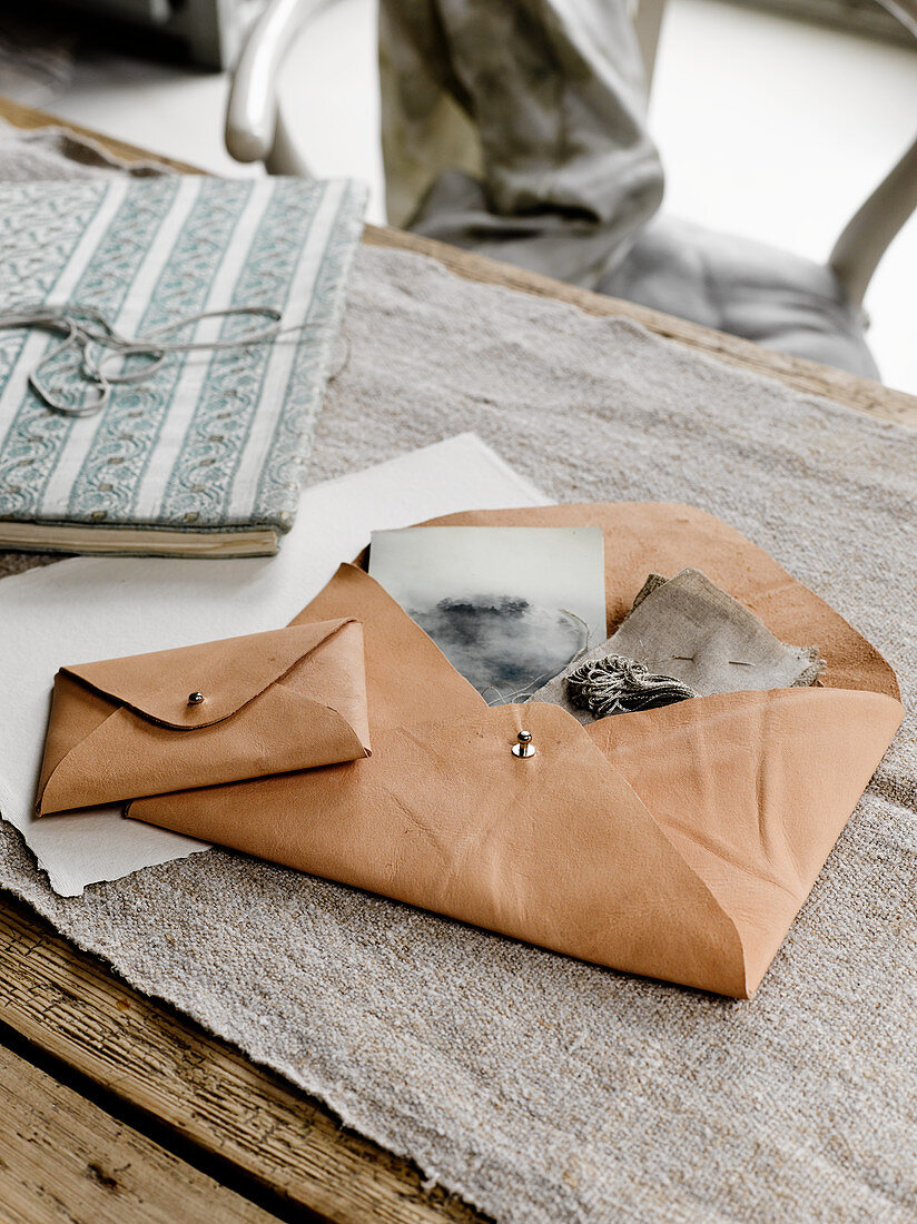 Pale leather envelopes used as storage bags