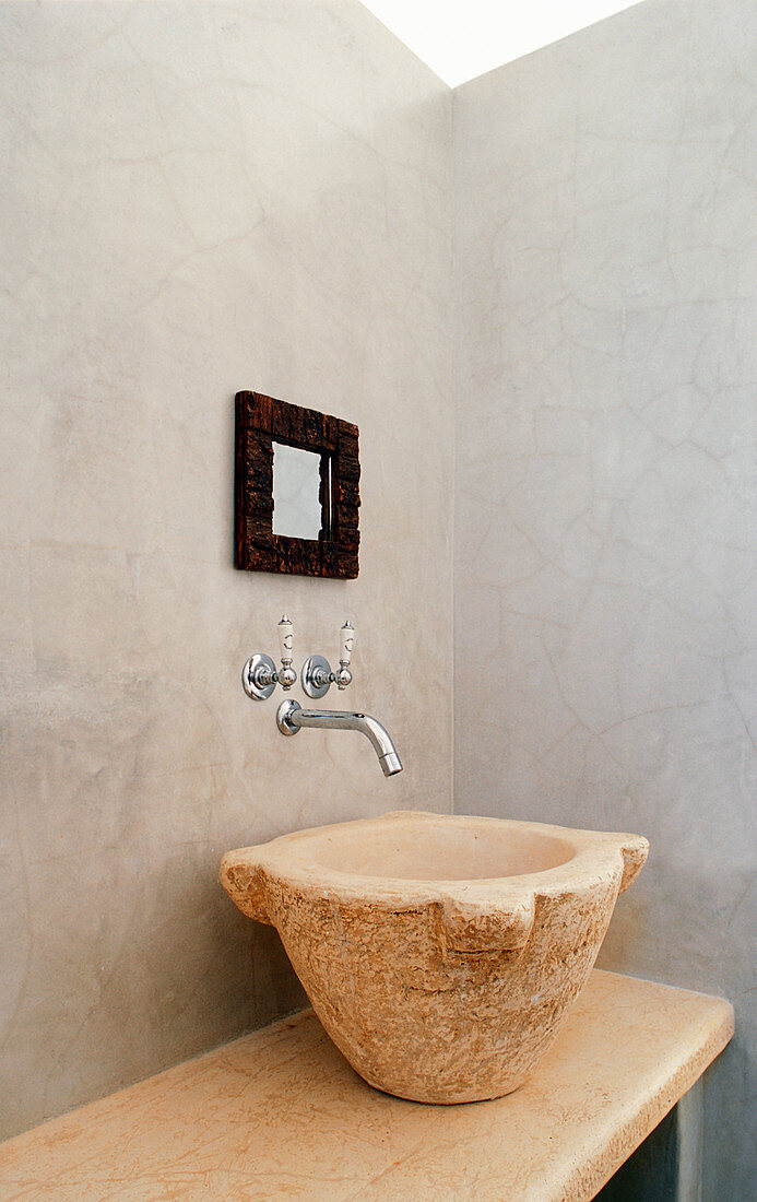 Sink made from large old stone mortar