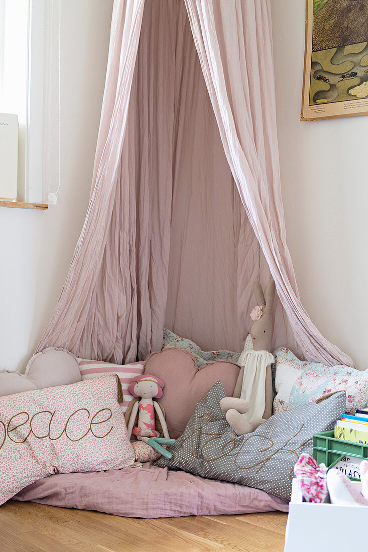 Cosy corner in pink with canopy in girl's bedroom