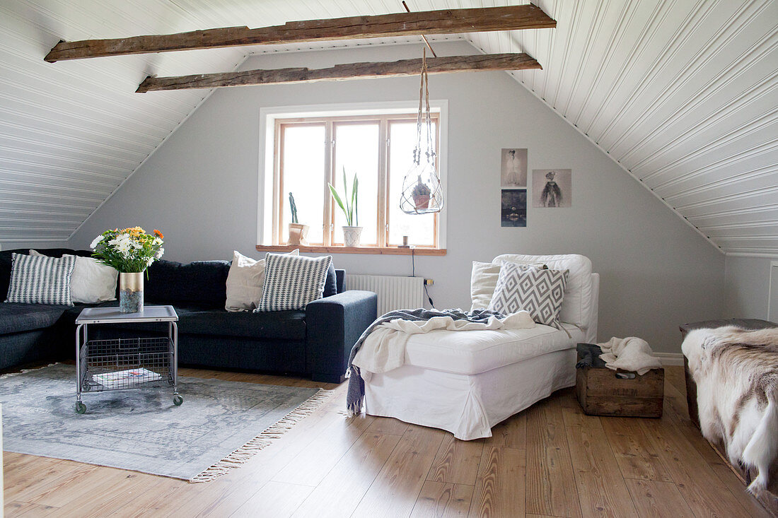 Cosy attic living room with panelled ceiling