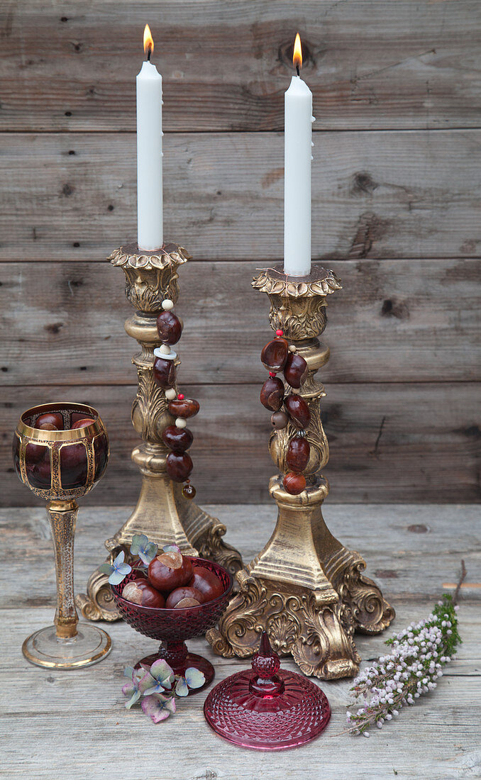 Candlesticks with handmade horse-chestnut decorations
