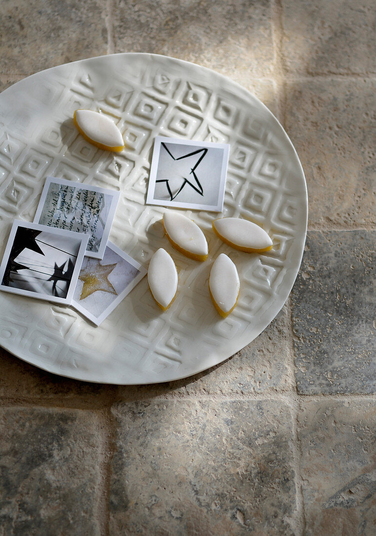 Biscuits and photos of stars on embossed plate