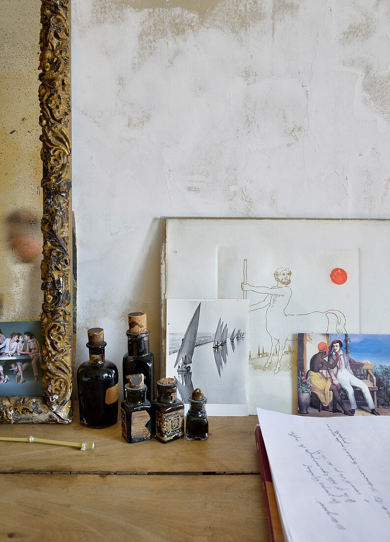 Artistic still-life arrangement of pictures and old bottles