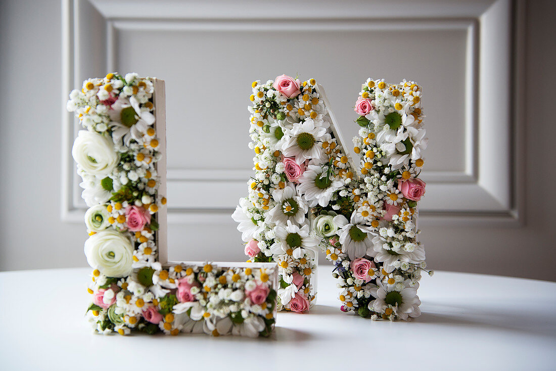 Ornamental letters romantically decorated with flowers