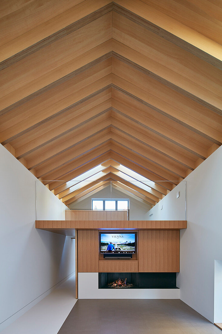 Open roof structure in modern architect-designed house with mezzanine