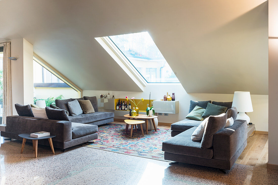 Sofa in set in elegant attic living room