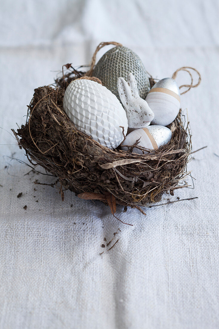Decorative eggs and Easter bunny in Easter nest