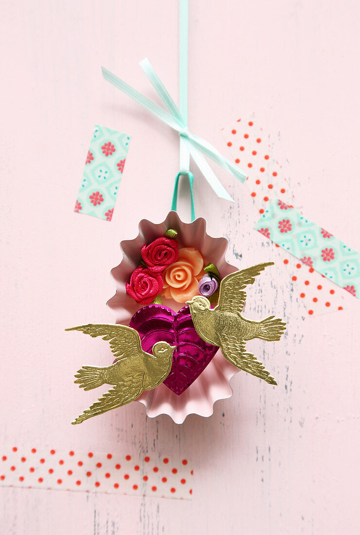 Romantic 3D diorama of fabric flowers and golden doves