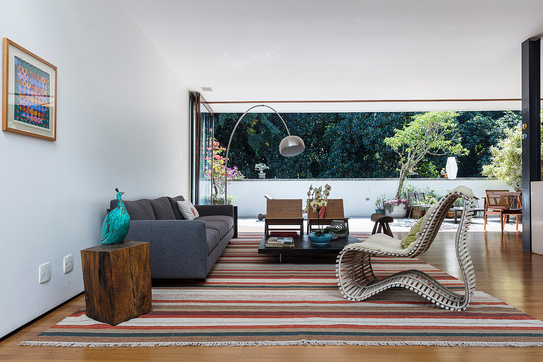 Various designer furnishings in earthy colours in living room
