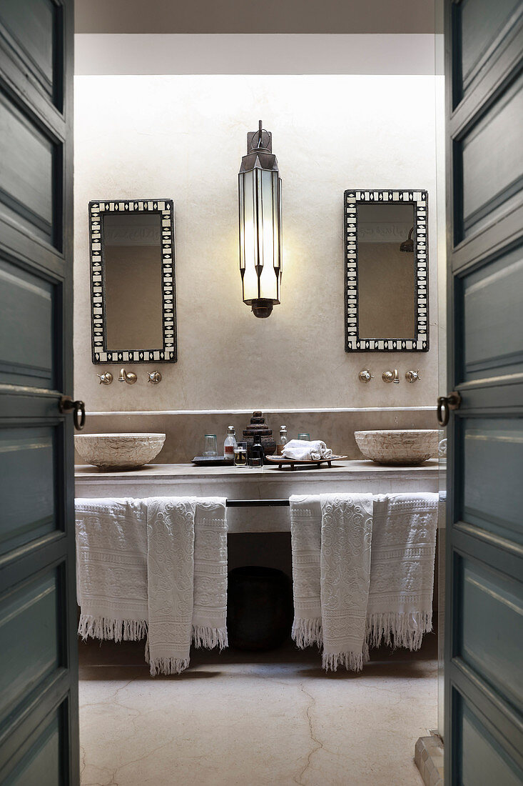 Washstand with twin countertop sinks in Oriental bathroom