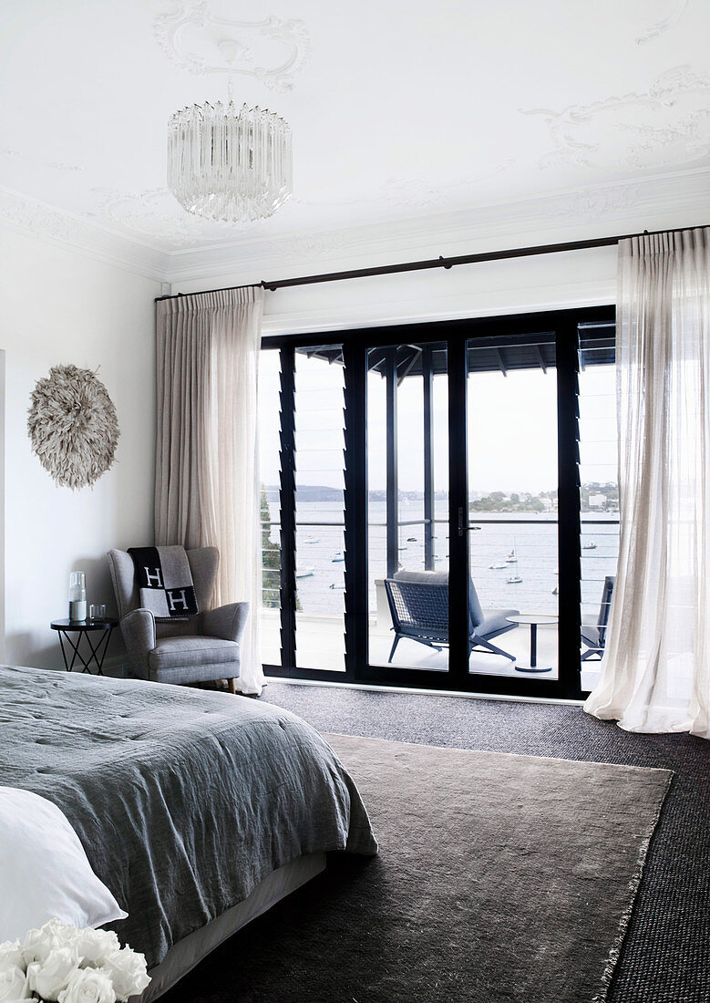 Elegant bedroom with balcony and sea view