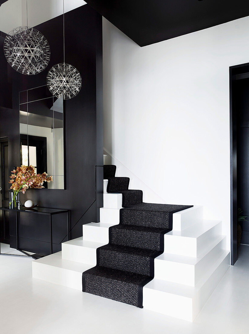 Elegant, black and white hallway with stairs