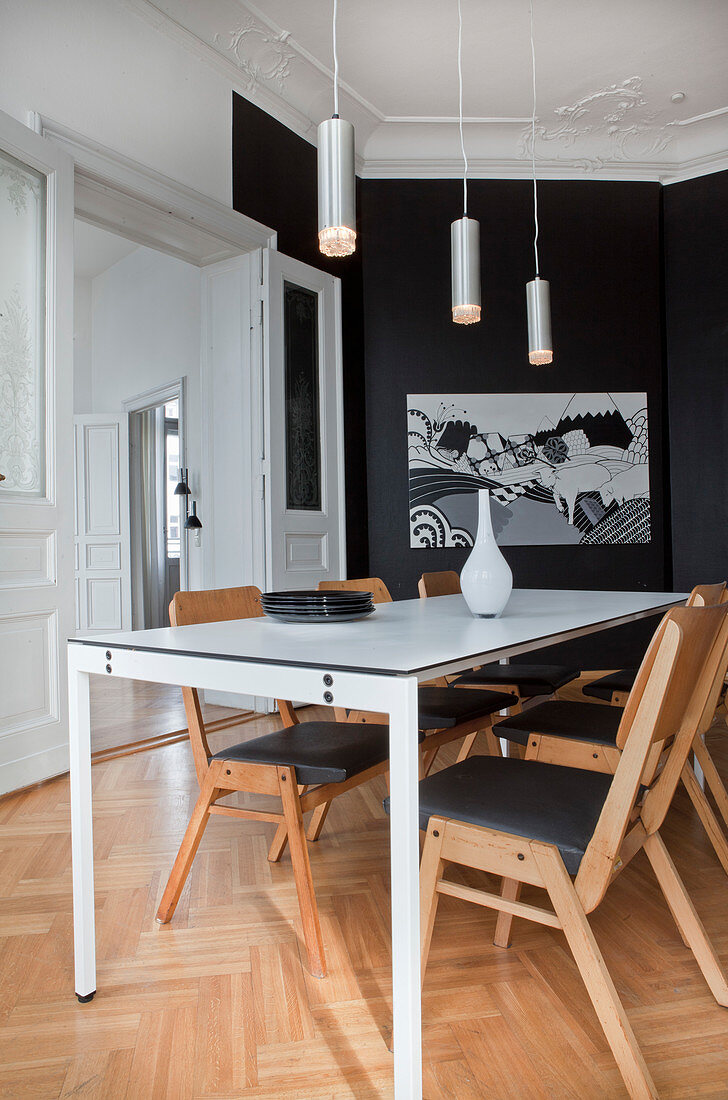 Elegant black-and-white dining room in period apartment