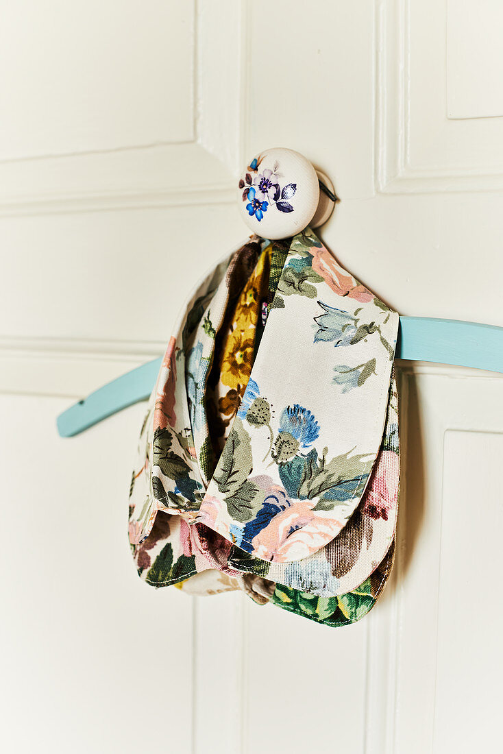 Collar of floral fabric on coat hanger