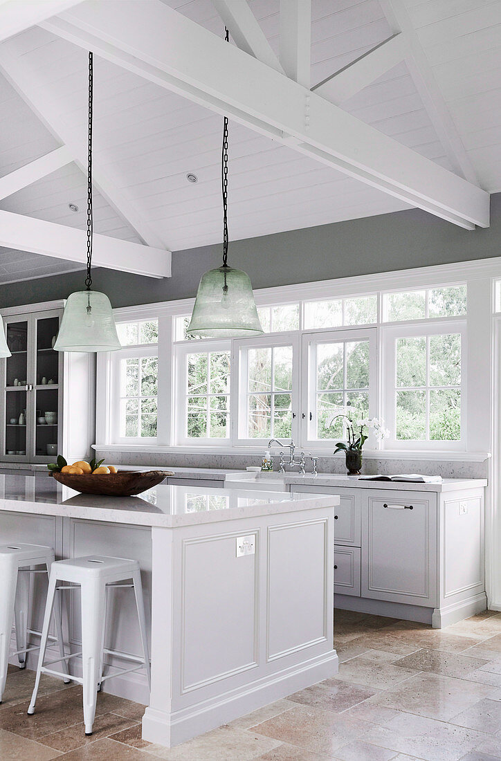 Modern country kitchen in light gray with kitchen island and open roof