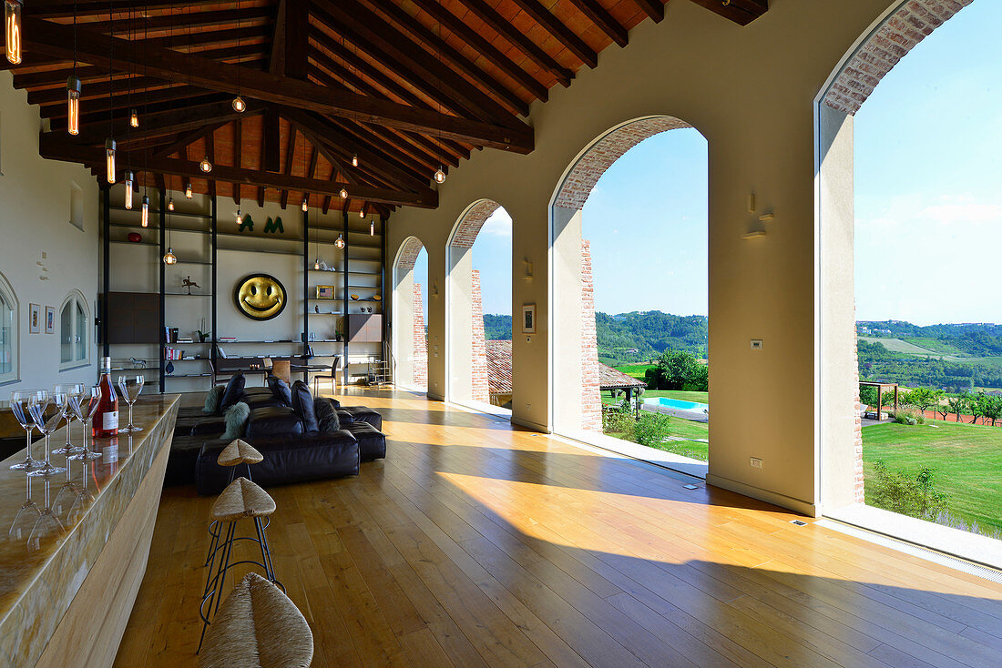Elegant loggia with arched openings in renovated farmhouse