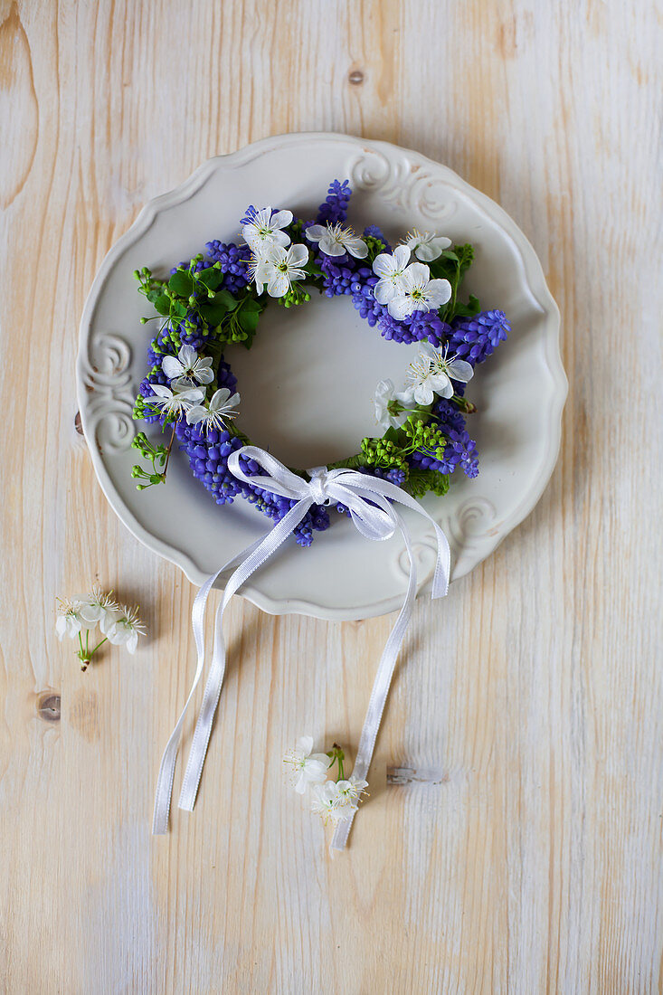 Spring wreath of grape hyacinths on plate