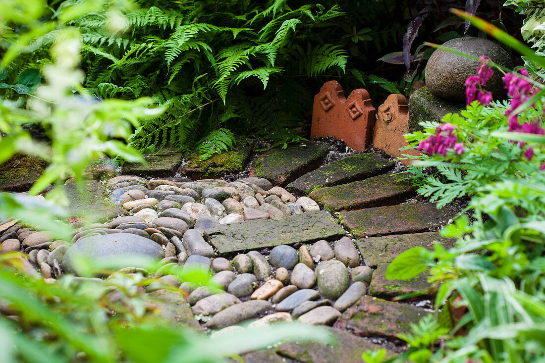 Circular pebbles and bricks in the garden