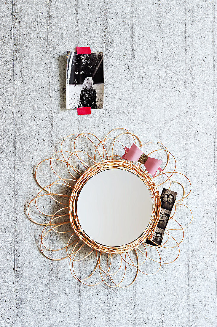 A mirror with a homemade wicker frame