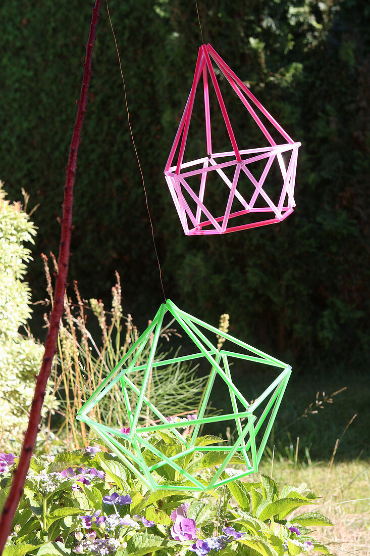 Geometric decoration made from colourful drinking straws in garden