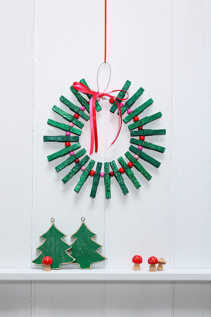 Christmas wreath made from green-painted clothes pegs