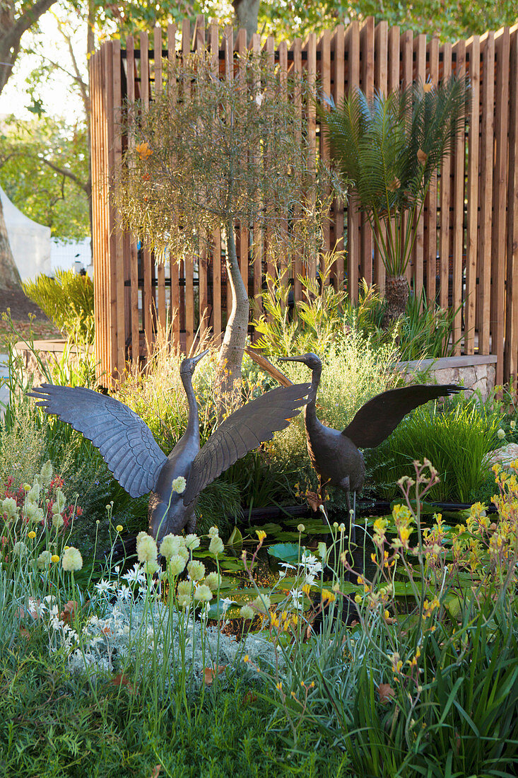 Bronze crane figure in the garden