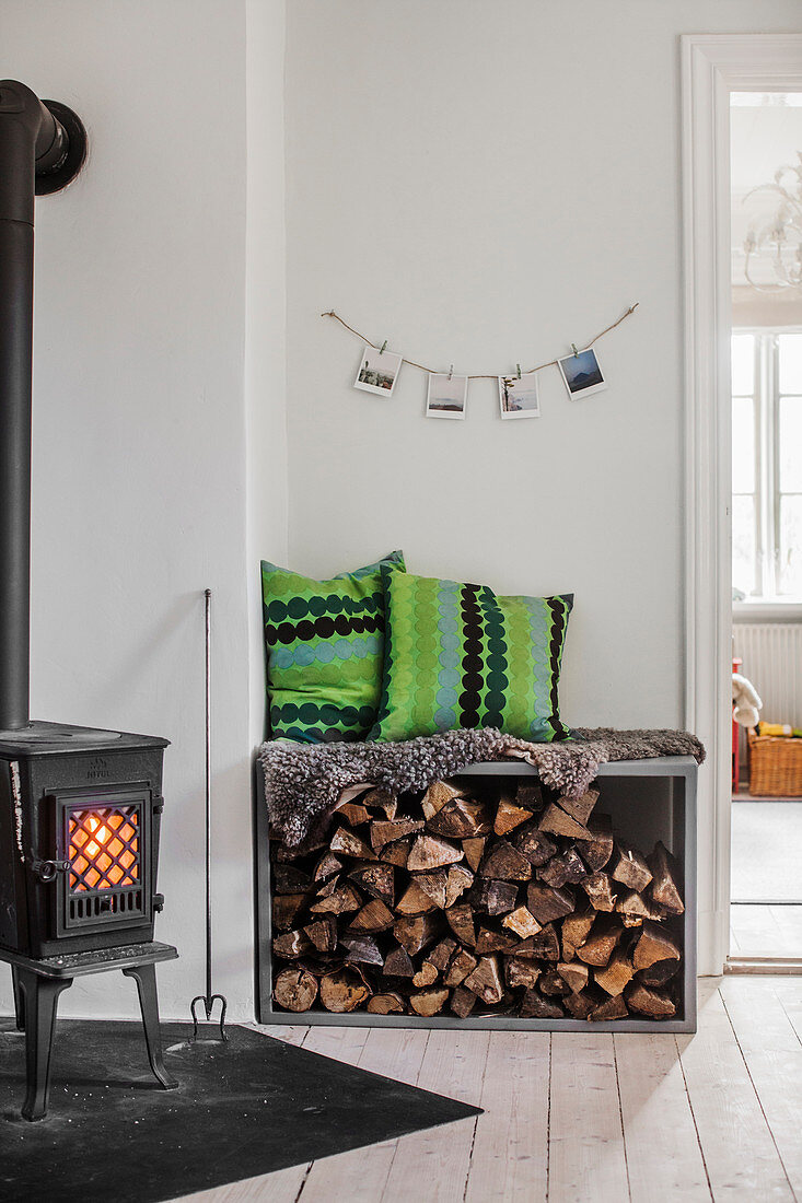 Log burner and bench with firewood store below