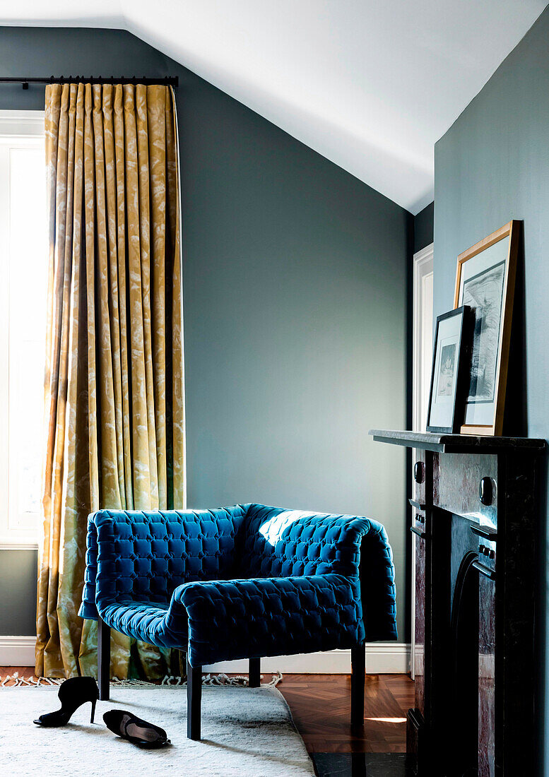 Modern blue armchair with structured velvet cover