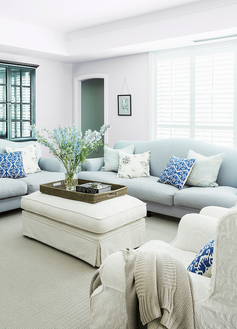 Bright, pastel-colored upholstered furniture in the living room