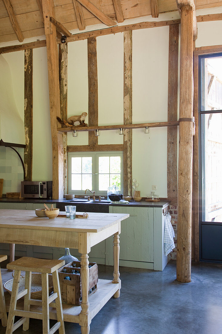 Open-plan country-house-style kitchen in converted barn