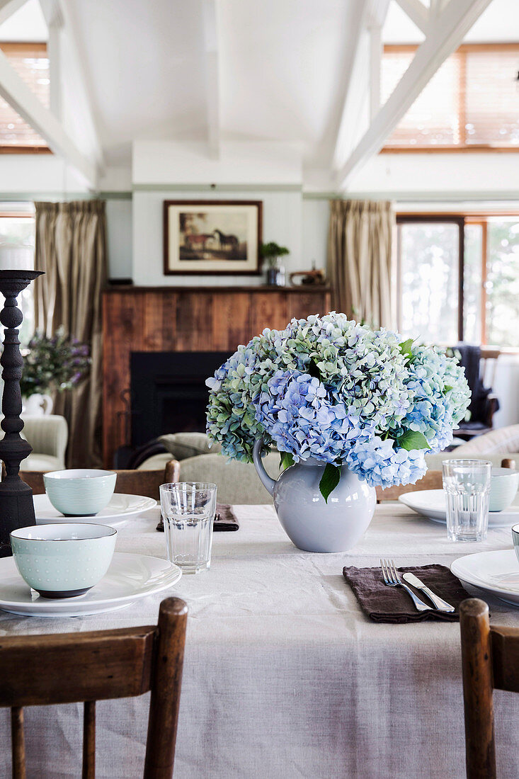 Laid table with bouquet of hydrangeas