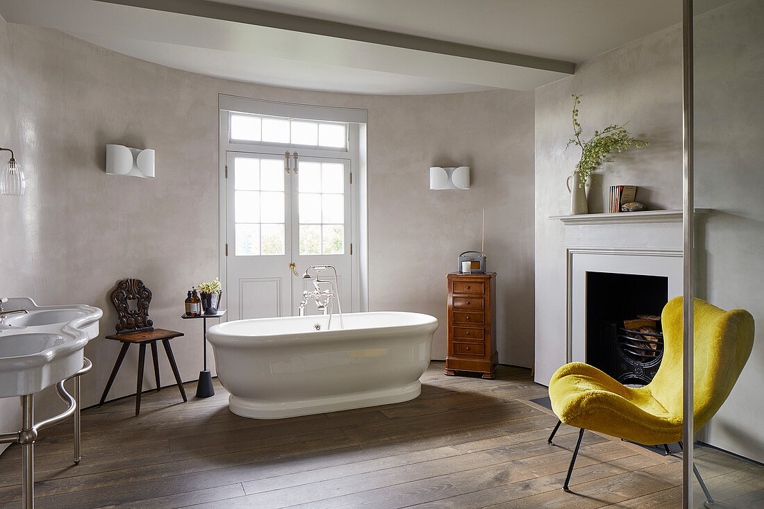 Yellow easy chair in classic bathroom with curved wall